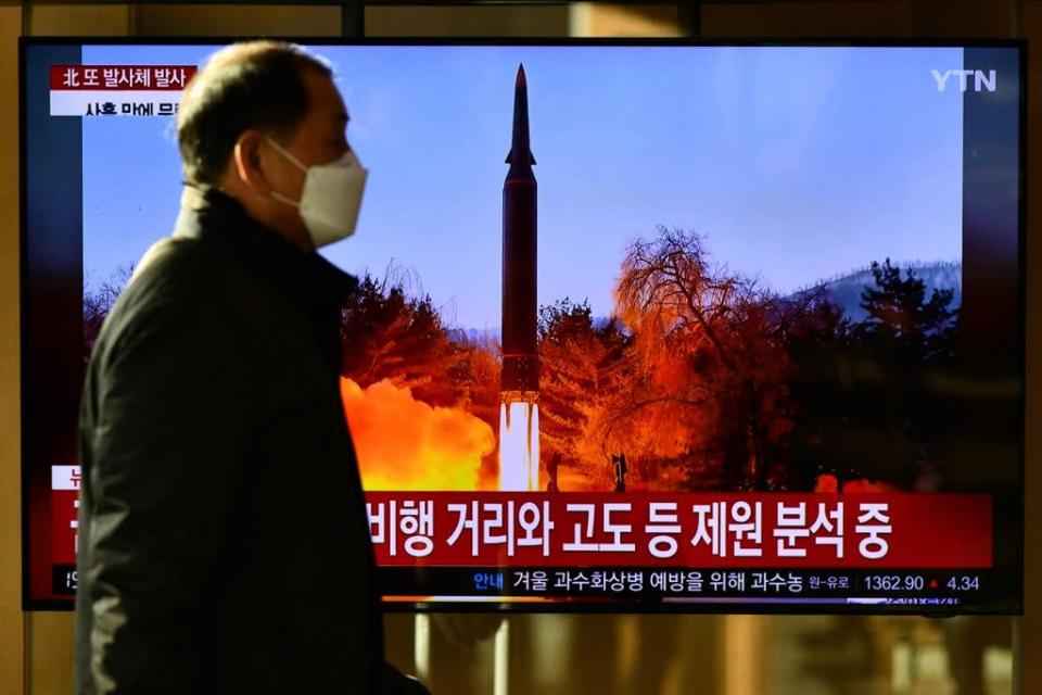 A man walks past a video screen in Seoul showing footage of a North Korean missile test (AFP via Getty Images)