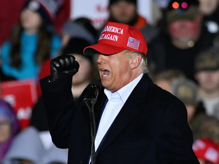 A picture of former President Donald Trump at a rally in South Carolina, wearing a MAGA hat