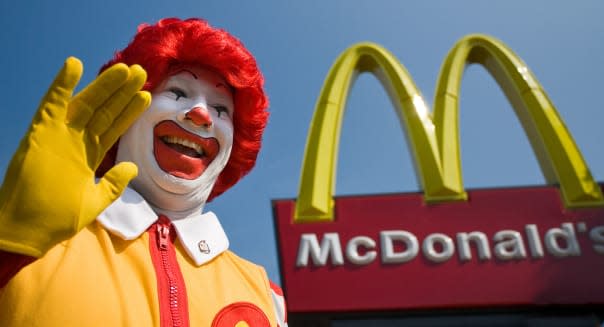 Ronald McDonald waves to kids outside a newly opened McDonald's franchise in West Haven, CT, USA