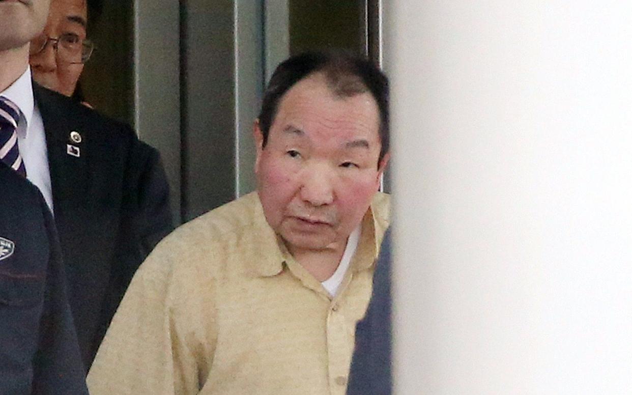 Hakamada leaving court - Jiji Press/AFP