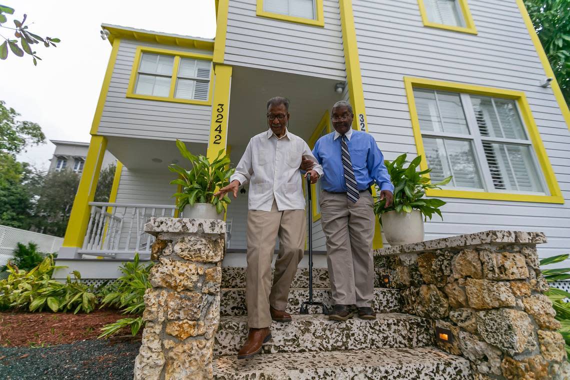 George Simpson, right, and his father, Dr. George Simpson, whose family owns the 1897 E.W.F. Stirrup House, have restored the home in Black Coconut Grove, with the help of development partners. The historic home operates as a lodging and event space.