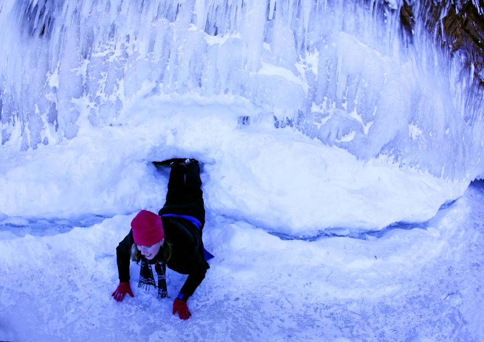 In this Feb. 2, 2014 photo people visit the caves at Apostle Islands National Lakeshore in northern Wisconsin, transformed into a dazzling display of ice sculptures by the arctic siege gripping the Upper Midwest. The caves are usually are accessible only by water, but Lake Superior’s rock-solid ice cover is letting people walk to them for the first time since 2009. (AP Photo/Minneapolis Star Tribune, Brian Peterson) MANDATORY CREDIT; ST. PAUL PIONEER PRESS OUT; MAGS OUT; TWIN CITIES TV OUT