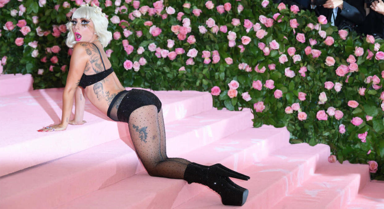 Lady Gaga stripped off four layers of outfits at the Met Gala. [Photo: Getty]