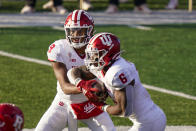 Indiana quarterback Michael Penix Jr. (9) hands off to running back Sampson James (6) during the second quarter of the team's NCAA college football game against Rutgers, Saturday, Oct. 31, 2020, in Piscataway, N.J. (AP Photo/Corey Sipkin)