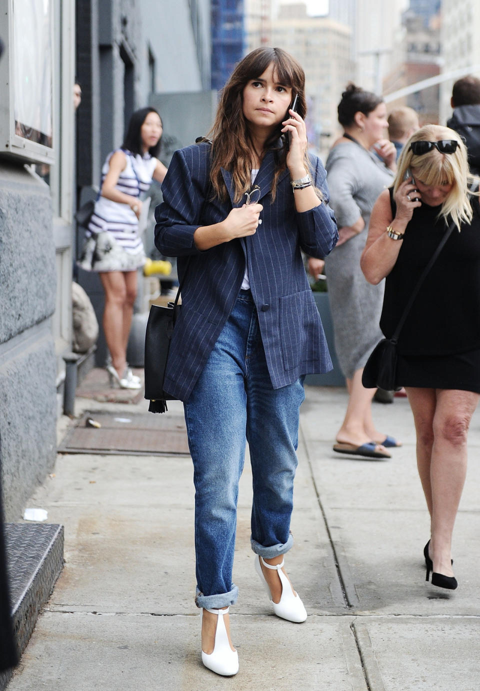 Miroslava Duma in jeans and a blazer at New York Fashion Week.