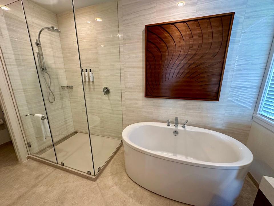 Large en suite bathroom with shower and tub 