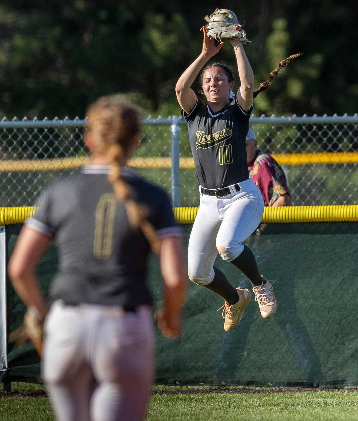 Kuna left fielder Gracie Nelson saves what might have been a home run with a leaping catch in the bottom of the sixth inning of the 5A District Three softball championship game.