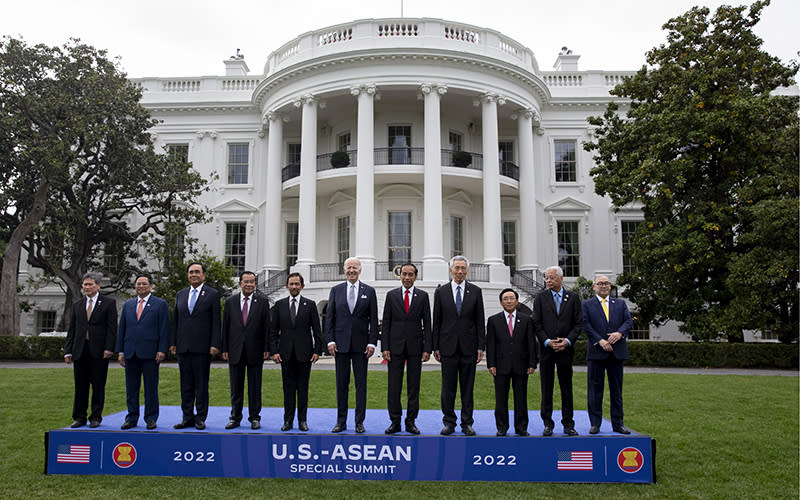 President Biden poses with leaders of the US-ASEAN Special Summit on a small stage made for the occasion on the South Lawn of the White House