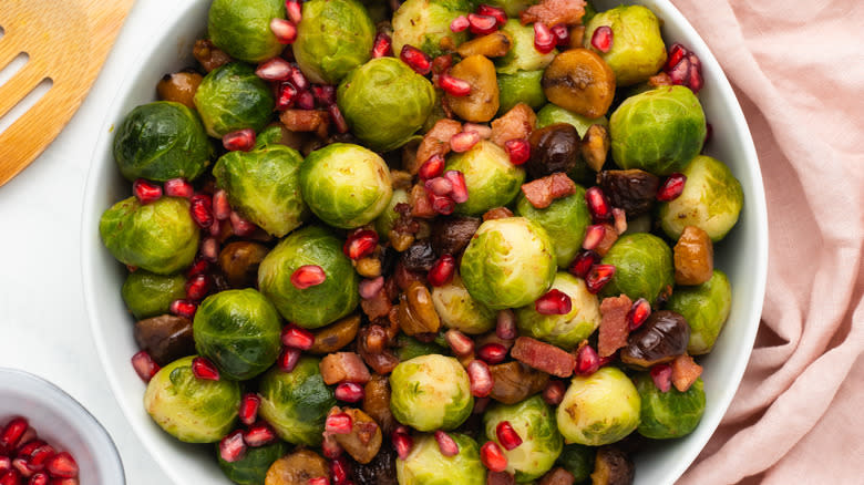 Close up of Brussels sprouts with bacon and chestnuts