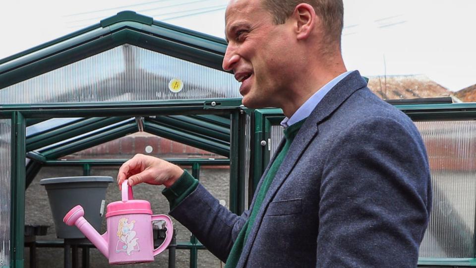 Prince William, Duke of Cambridge shares a joke with staff during a visit to Brighter Futures in Wales