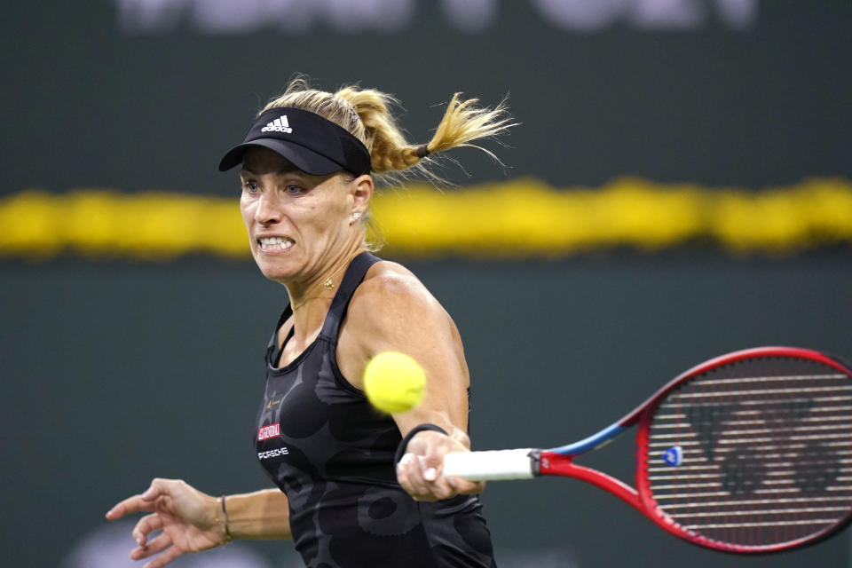 Angelique Kerber, of Germany, hits a forehand to Paula Badosa, of Spain, at the BNP Paribas Open tennis tournament Thursday, Oct. 14, 2021, in Indian Wells, Calif. (AP Photo/Mark J. Terrill)