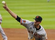 San Francisco Giants starting pitcher Kevin Gausman (34) throws against the Colorado Rockies during the first inning of a baseball game, Tuesday, Aug. 4, 2020, in Denver. (AP Photo/Jack Dempsey)
