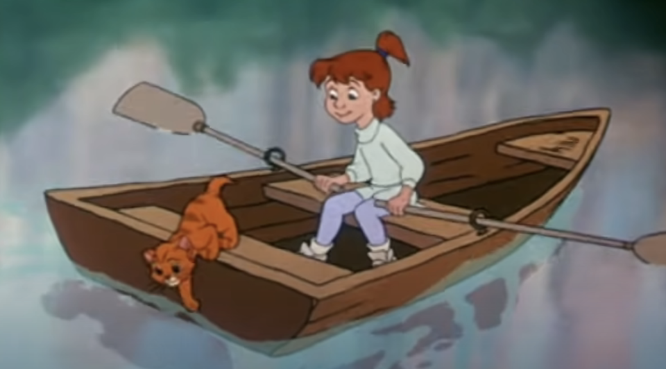 a girl and her cat on a canoe