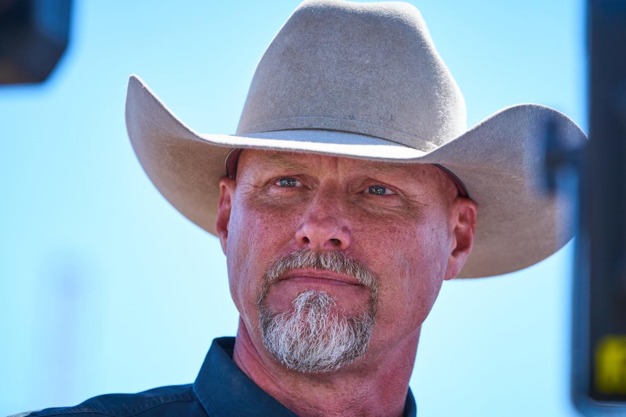 Pinal County Sheriff Mark Lamb gives an interview to the media during former President Donald Trump's rally at Legacy Sports Park in Mesa on Oct. 9, 2022.