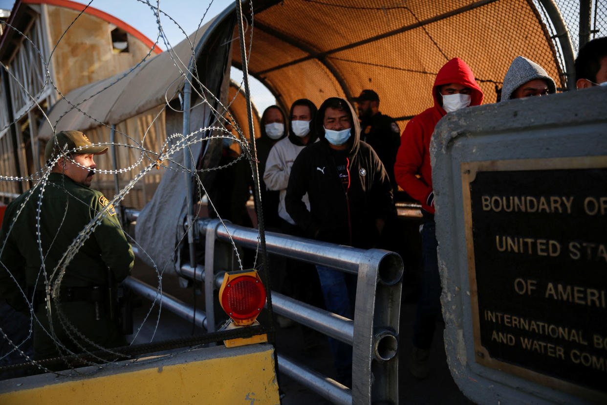 Migrants expelled from the U.S. and sent back to Mexico under Title 42, walk towards Mexico