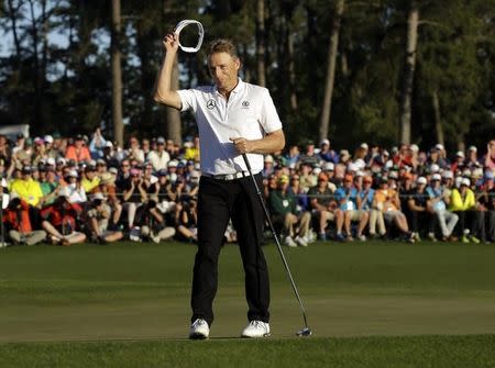 Apr 10, 2016; Augusta, GA, USA; Bernhard Langer waves to the crowd after completing the final round of the 2016 The Masters golf tournament at Augusta National Golf Club. Mandatory Credit: Rob Schumacher-USA TODAY Sports