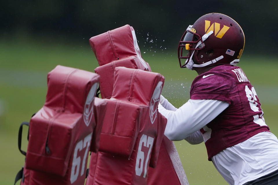 Washington Commanders defensive tackle Jonathan Allen (93) works during practice at the team's NFL football training facility, Tuesday, May 24, 2022 in Ashburn, Va. (AP Photo/Alex Brandon)