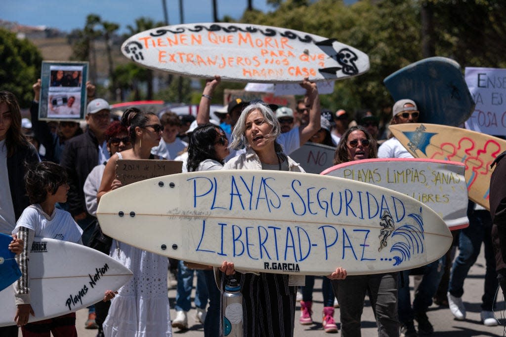 Protesters with surf boards