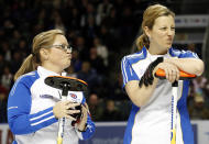 British Columbia skip Kelly Scott looks on with Sasha Carter while they play Team Canada during their page playoff 3-4 game at the Scotties Tournament of Hearts curling championship in Kingston, February 23, 2013. REUTERS/Mark Blinch (CANADA - Tags: SPORT CURLING) - RTR3E6SF