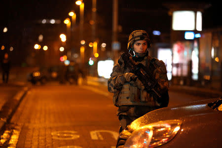 Soldier secures area where a suspect is sought after a shooting in Strasbourg, France, December 11, 2018. REUTERS/Vincent Kessler