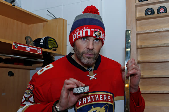 SUNRISE, FL - DECEMBER 22: Jaromir Jagr #68 of the Florida Panthers poses with puck marked with 