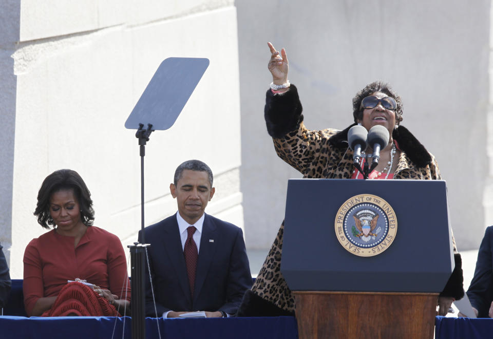 FILE - In this Oct. 16, 2011 file photo, Aretha Franklin sings as President Barack Obama and first lady Michelle Obama look on during the dedication of the Martin Luther King Jr. Memorial in Washington. Franklin died Thursday, Aug. 16, 2018 at her home in Detroit. She was 76. (AP Photo/Charles Dharapak, File)