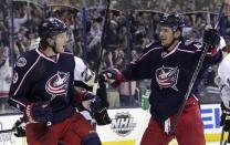 Columbus Blue Jackets' Ryan Johansen, left, celebrates his goal against the Pittsburgh Penguins with teammate Artem Anisimov, of Russia, during the second period of Game 4 of a first-round NHL hockey playoff series on Wednesday, April 23, 2014, in Columbus, Ohio. (AP Photo/Jay LaPrete)
