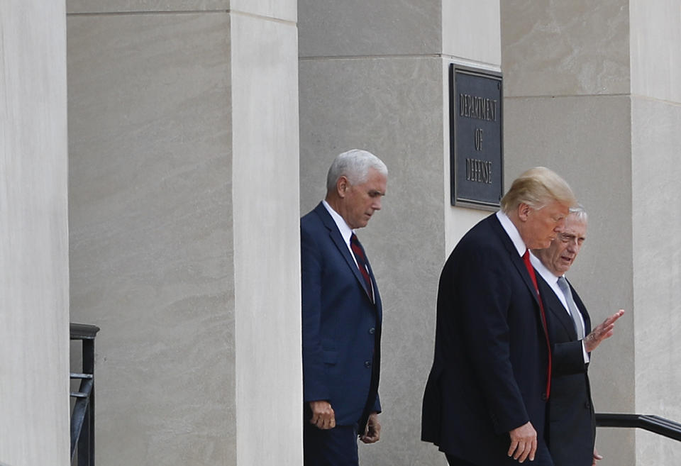 Defense Secretary Jim Mattis, right, talks with President Donald Trump, center, followed by Vice President Mike Pence, left, after being briefed by members of Trump’s national security team during a visit to the Pentagon, Thursday, July 20, 2017. (AP Photo/Pablo Martinez Monsivais)