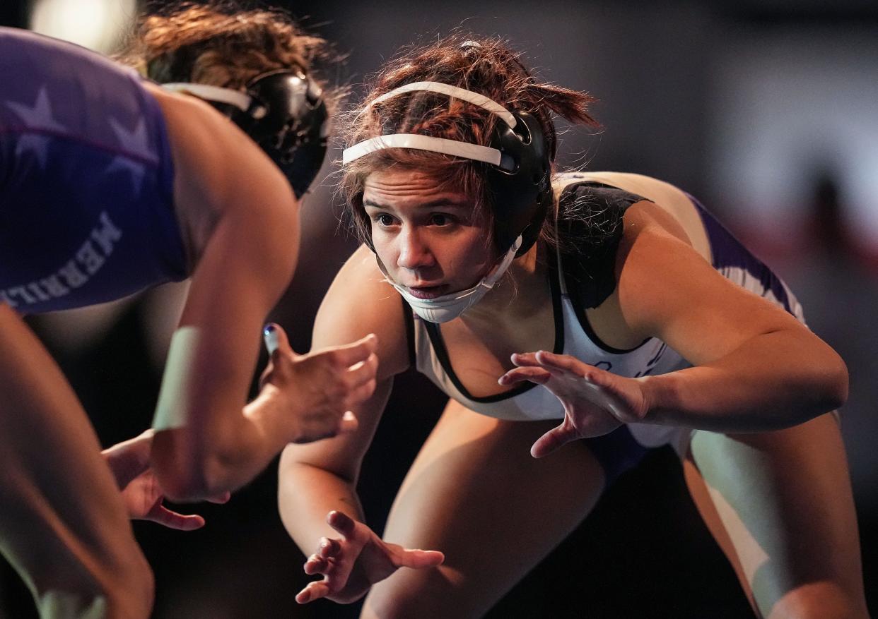 New Haven's Julianna Ocampo wrestles Merrillville's Joy Cantu in the 110-pound bout Friday, Jan. 12, 2023, during the Indiana High School Girls Wrestling state finals at Memorial Gymnasium in Kokomo.