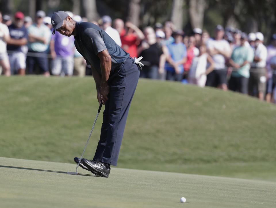 Tiger Woods reacts to a missed putt on the 14th green during the second round of The Players Championship. (AP)