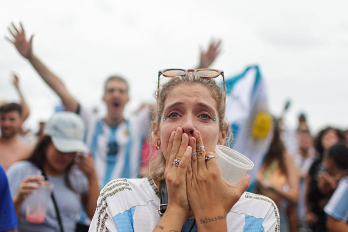 An Argentinian fan reacts as people watch the FIFA World Cup Qatar 2022 final match between Argentina and France at the Buenos Aires bar in Copacabana beach, in Rio de Janeiro, Brazil, December 18, 2022. REUTERS/Pilar Olivares