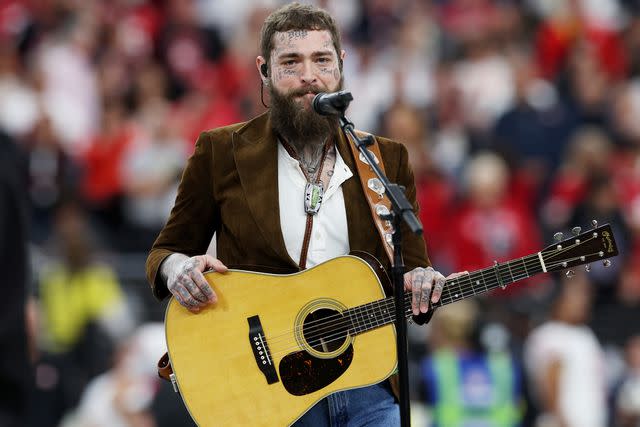 <p>Jamie Squire/Getty </p> Post Malone performs at the Super Bowl in Las Vegas in February 2024