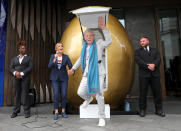 <p>Sir Ian McKellen appears from a giant golden egg during his announcement for an Ambassador Theatre Group Productions tour of <em>Mother Goose</em> at The Londoner Hotel in London on Oct. 3. </p>