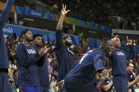 2016 Rio Olympics - Basketball - Final - Men's Gold Medal Game Serbia v USA - Carioca Arena 1 - Rio de Janeiro, Brazil - 21/8/2016. Players on the United States bench celebrate a three point basket. REUTERS/Shannon Stapleton