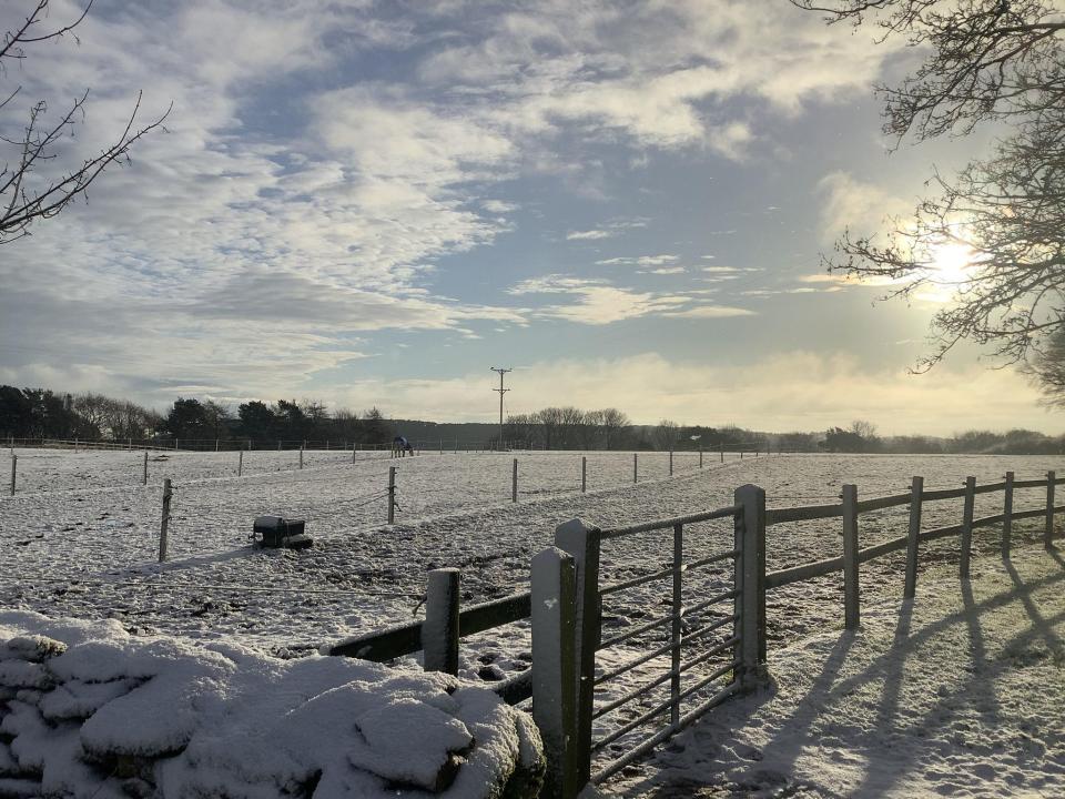 Suffield Ings Farm in Hackness, Scarborough, saw snow as the sun rose up this morning (PA)