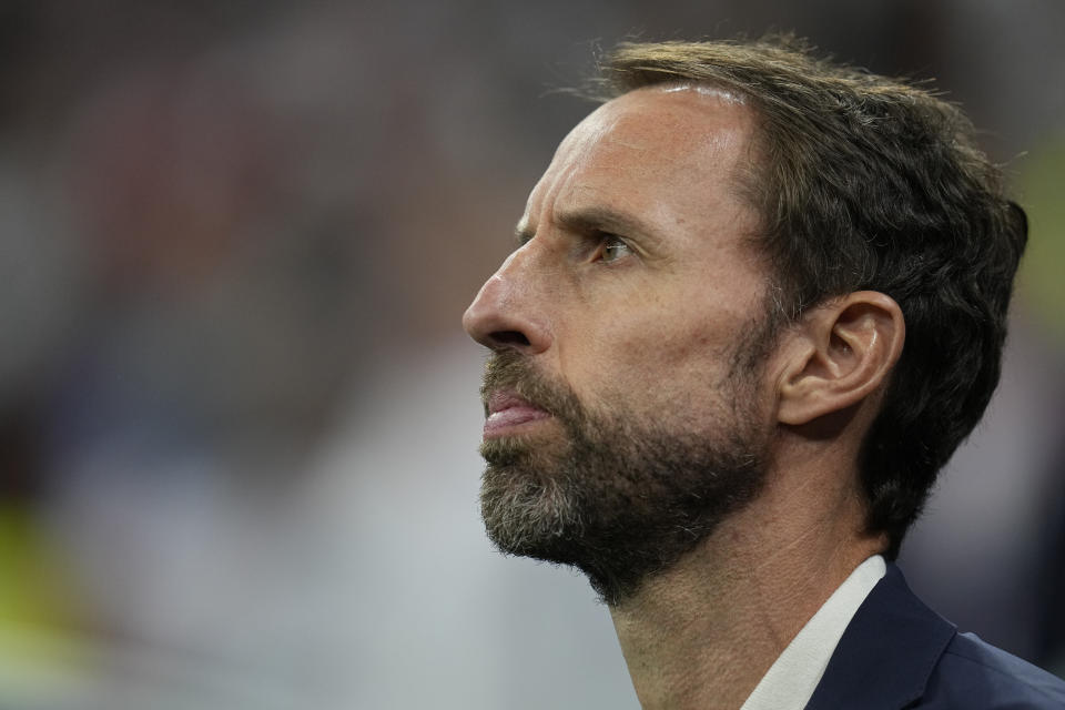 England's head coach Gareth Southgate stands during his national anthem prior to the World Cup quarterfinal soccer match between England and France, at the Al Bayt Stadium in Al Khor, Qatar, Saturday, Dec. 10, 2022. (AP Photo/Abbie Parr)