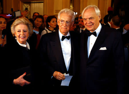 Mario Monti his wife Elsa Antonio and Alexander Pereira pose before the opening of the 2017-2018 opera season at La Scala theatre in Milan, Italy December 7, 2017. REUTERS/Stefano Rellandini