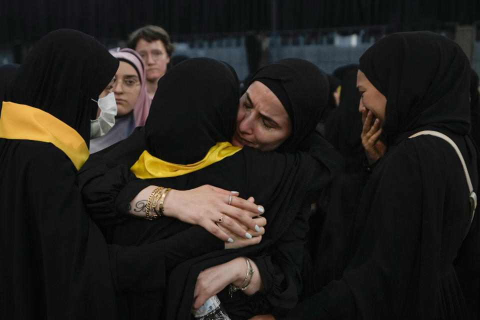 Relatives of senior commander Mohammad Naameh Nasser, who was killed by an Israeli airstrike that hit his car in the southern costal town of Tyre, mourn during his funeral procession in the southern suburbs of Beirut, Lebanon, Thursday, July 4, 2024. The strike took place as global diplomatic efforts have intensified in recent weeks to prevent escalating clashes between Hezbollah and the Israeli military from spiralling into an all-out war that could possibly lead to a direct confrontation between Israel and Iran. (AP Photo/Bilal Hussein)
