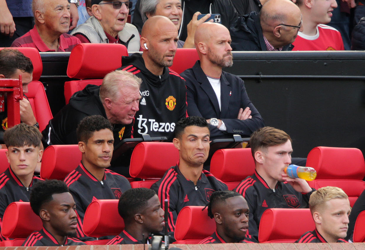 Manchester United manager Erik ten Hag (top right) and Cristiano Ronaldo (centre) during the Premier League match against Brighton at Old Trafford. 