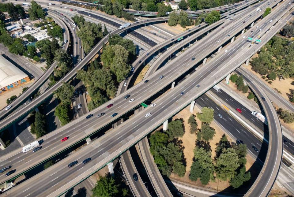 Vehicles move about various highways at the I-5 interchange in downtown Sacramento during evening commute hours on Friday, July 9, 2021.