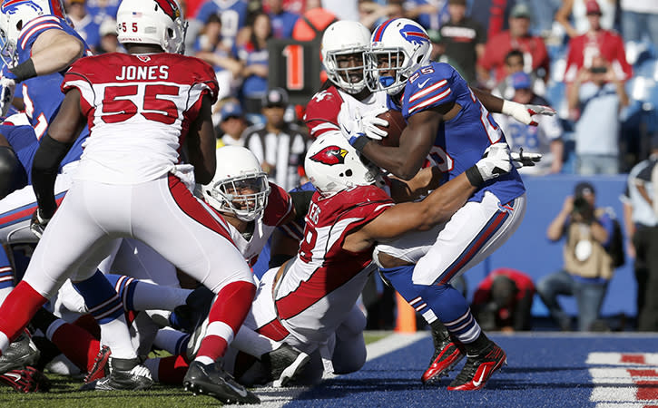 Sep 25, 2016; Orchard Park, NY, USA; Buffalo Bills running back LeSean McCoy (25) runs the ball and gets tackled by Arizona Cardinals defensive tackle Corey Peters (98) in the end zone for a safety during the second half at New Era Field. Bills beat the Cardinals 33-18.