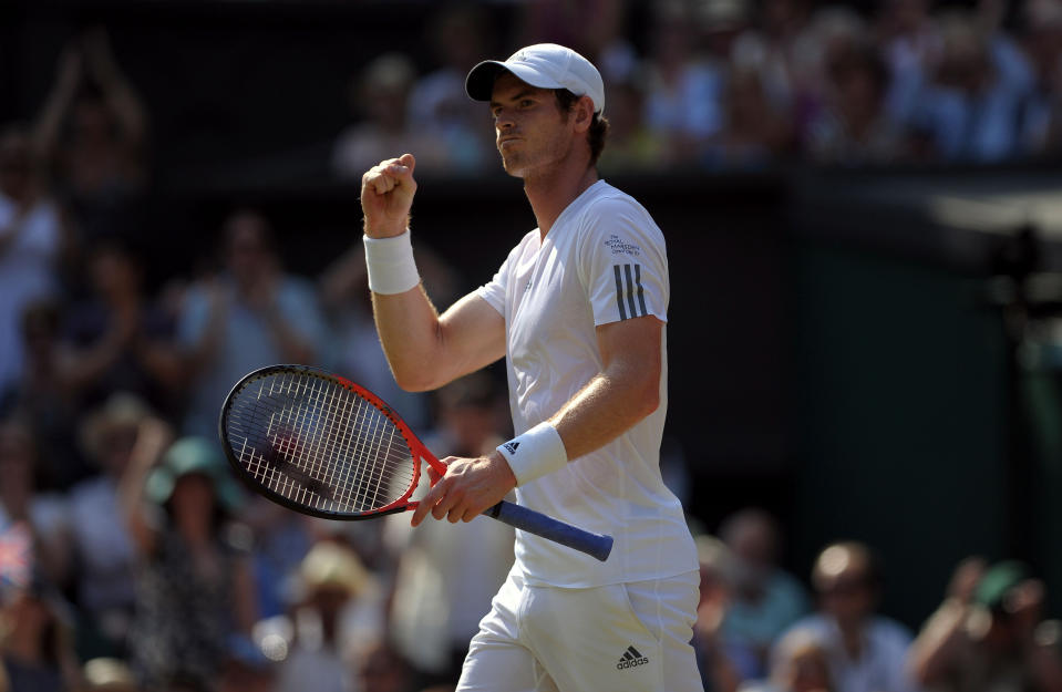 Great Britain's Andy Murray celebrates a point against Serbia's Novak Djokovic on day thirteen of the Wimbledon Championships at The All England Lawn Tennis and Croquet Club, Wimbledon.