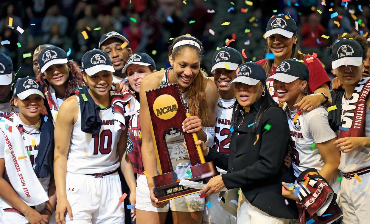 The University of South Carolina&nbsp;women's basketball team&nbsp;holds up the NCAA trophy after&nbsp;beating&nbsp;Mississippi State on April 2. (Photo: Ron Jenkins via Getty Images)