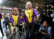 French cyclist Robert Marchand (L) prepares to start as he attempts to break his own world cycling record at the age of 105, taking part in a one-hour cycling event in the Masters + 100 category held at the Velodrome National in Montigny-les-Bretonneux, southwest of Paris, France, January 4, 2017. REUTERS/Jacky Naegelen