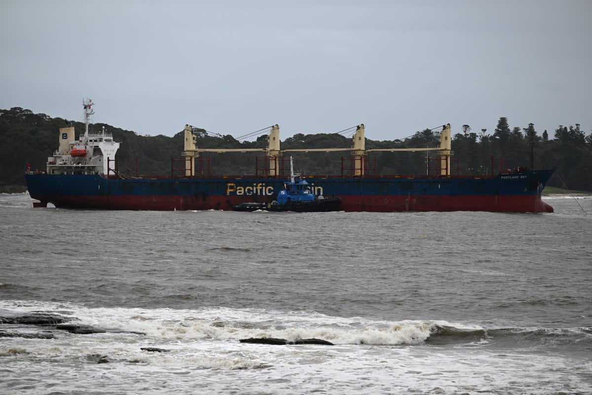 File: The Portland Bay cargo ship is towed safely into Port Botany, Sydney, New South Wales (EPA)