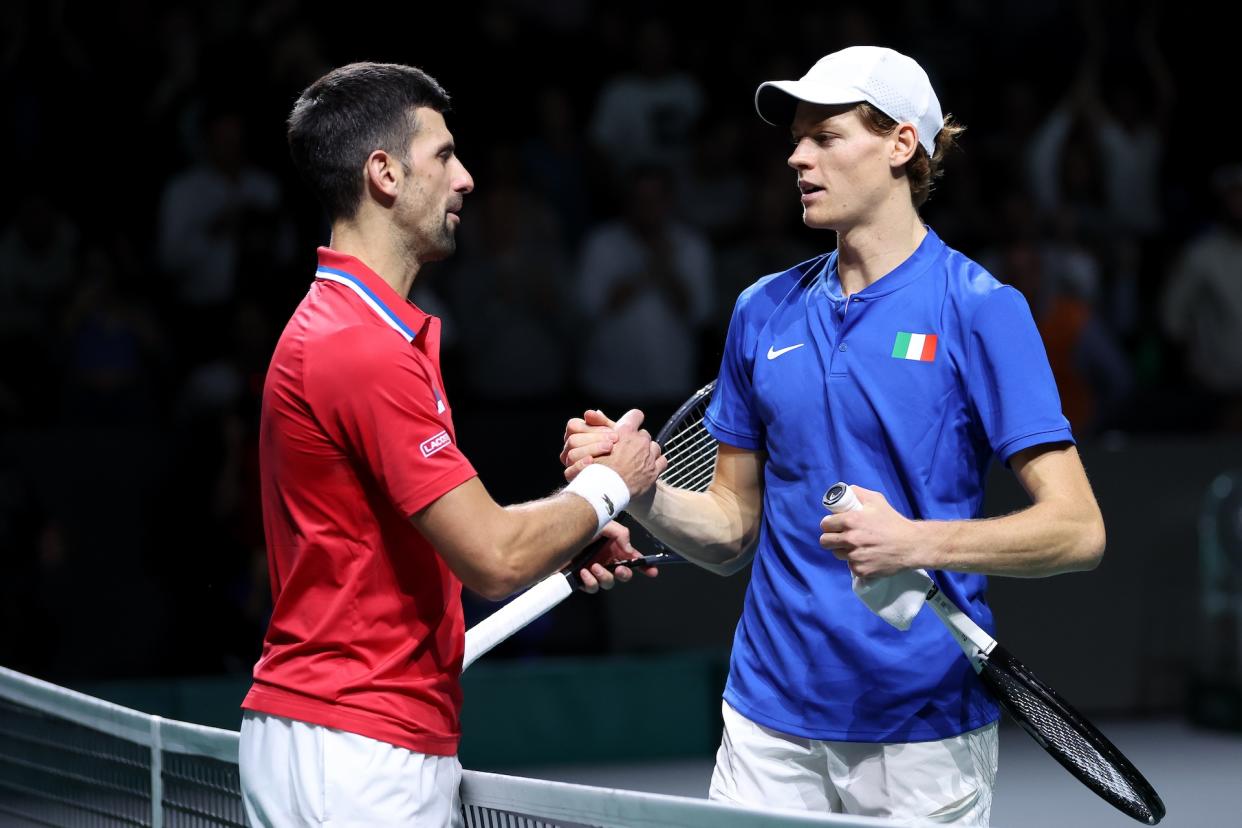 Sinner and Djokovic shake hands after Sinner's semifinal victory at the 2023 Davis Cup. (Clive Brunskill/Getty Images for ITF)