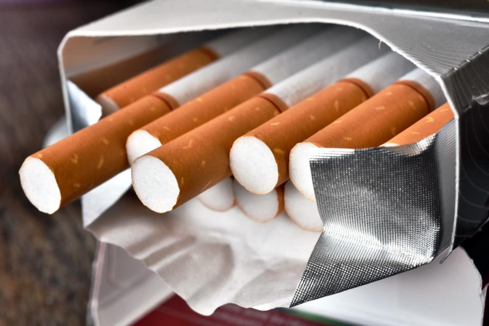 A close up image of an open package of cigarettes.