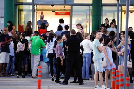 People stand outside a mall that was evacuated in the World Cup city of Samara, Russia June 28, 2018. REUTERS/Carlos Garcia Rawlins