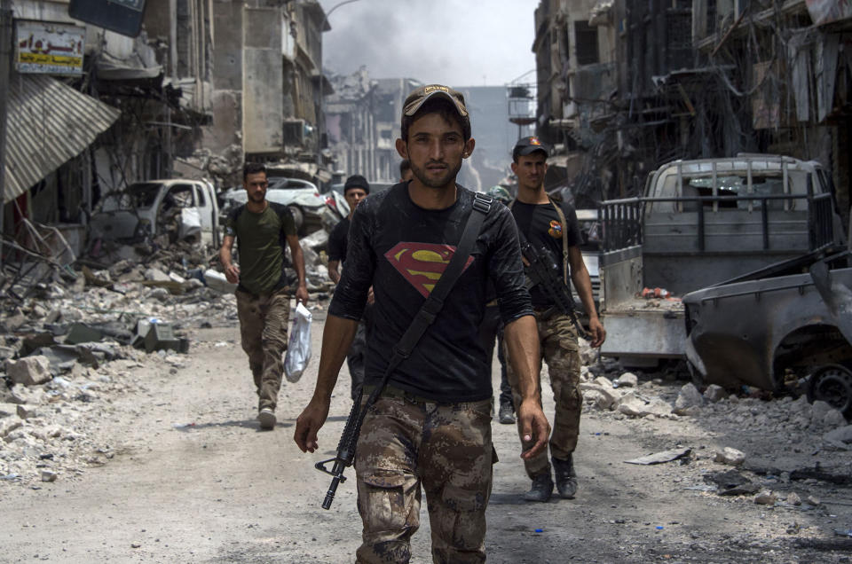 An Iraqi walks the streets