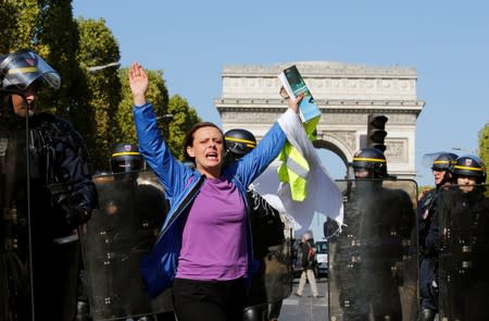 Protesters attend a demonstration on Act 45 (the 45th consecutive national protest on Saturday) of the yellow vests movement in Paris